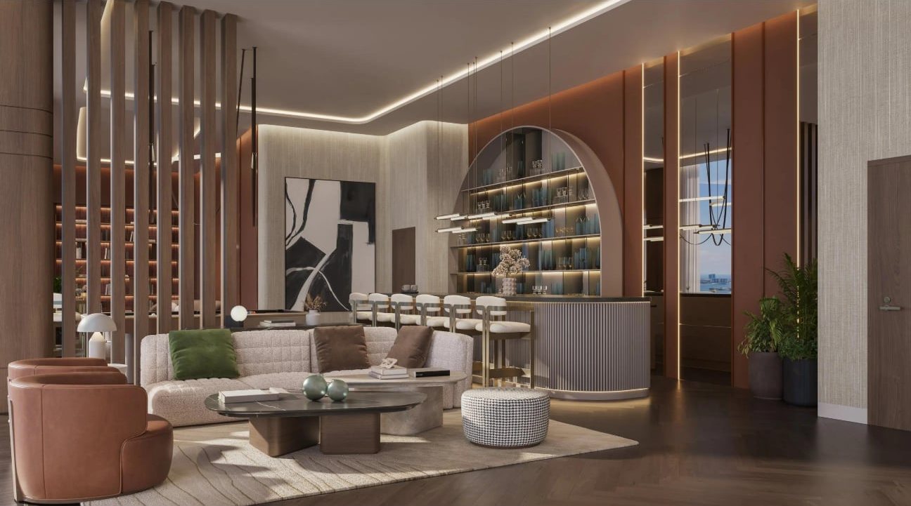 Warmly lit club lounge at Common Ground with a bar, artwork and comfortable seating